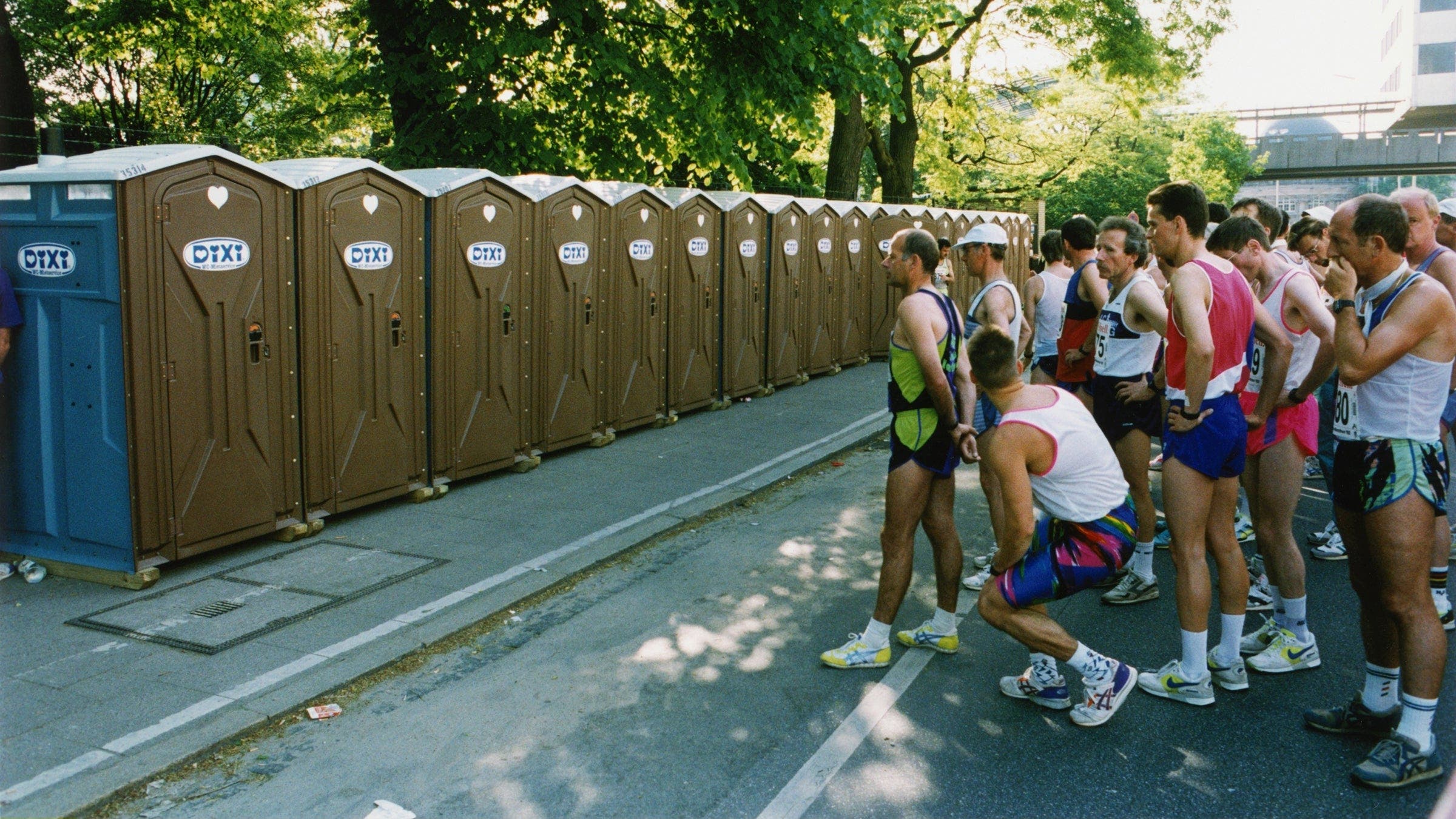 runners wait for porte-johns