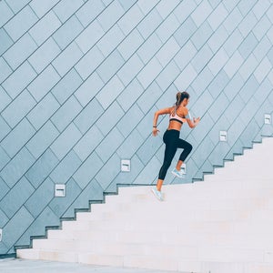 woman running up stairs