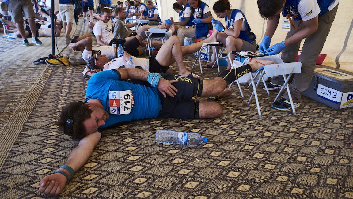 Competitors receive treatment for their tired and aching feet after the Stage 3 of the 32nd edition of the Marathon des Sables.