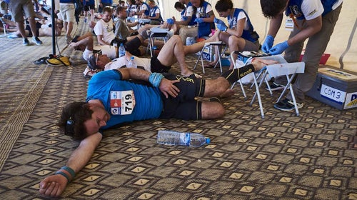 Competitors receive treatment for their tired and aching feet after the Stage 3 of the 32nd edition of the Marathon des Sables.