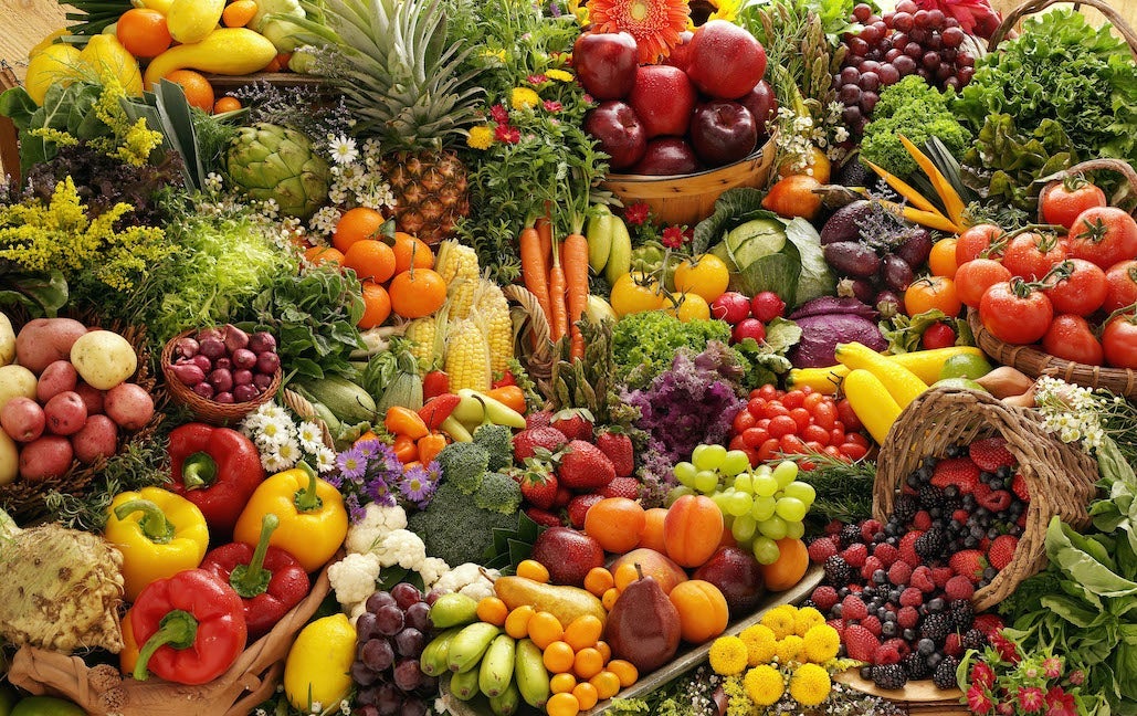 Lot's of colorful fruits and vegetables.