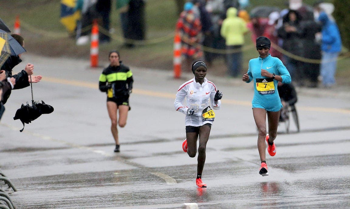 Mamitu Daska (right) is caught at the top of Heartbreak Hill by Gladys Chesir and eventual winner Desiree Linden (left) at the 2018 Boston Marathon on April 16, 2018.