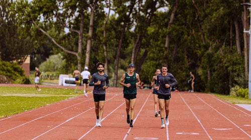 Morgan McDonald and other OAC runners running on the track.