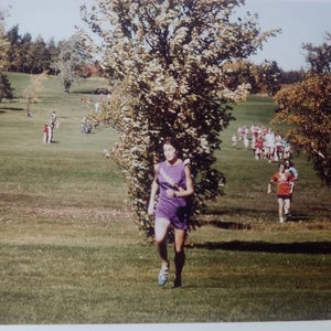 Photo of Toni St. Pierre running in a high school meet in the 1970s.