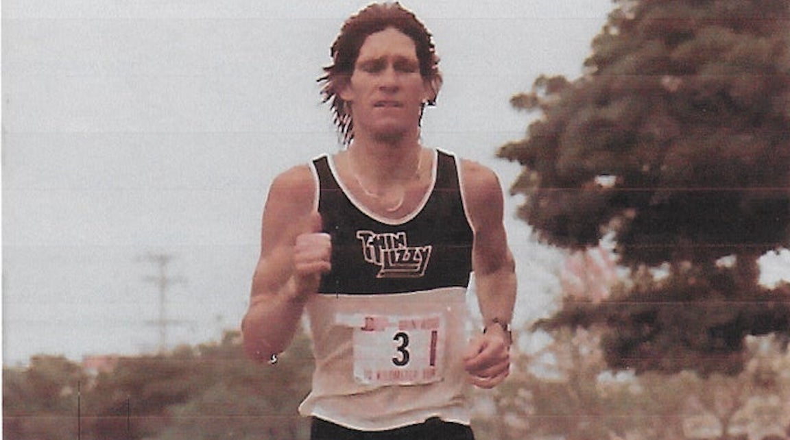 Old photo of Jon Sutherland running.