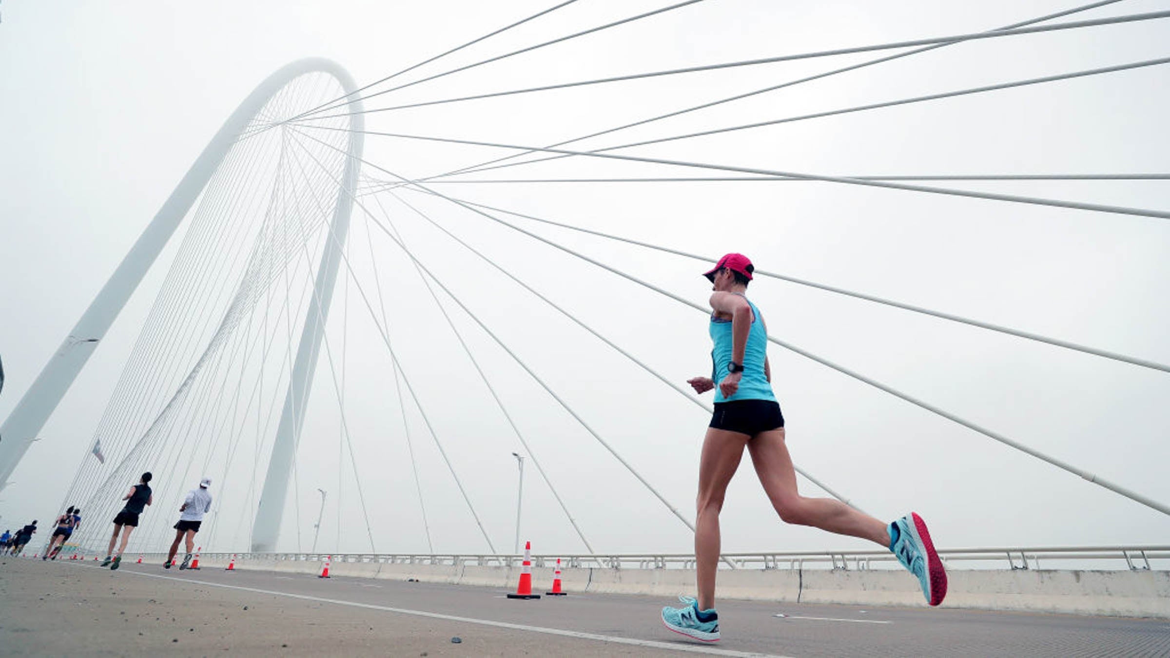 Participants run across the Margaret Hunt Hill Bridge during the Toyota Rock 'N' Roll Dallas Half Marathon