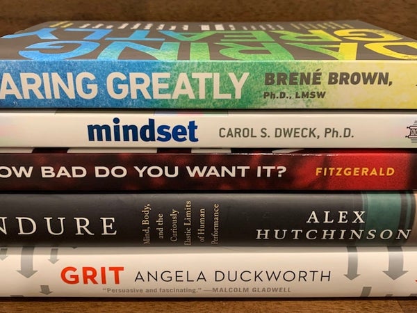 5 psychology books stacked.