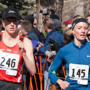 Deena Kastor and Shalane Flanagan running past spectators