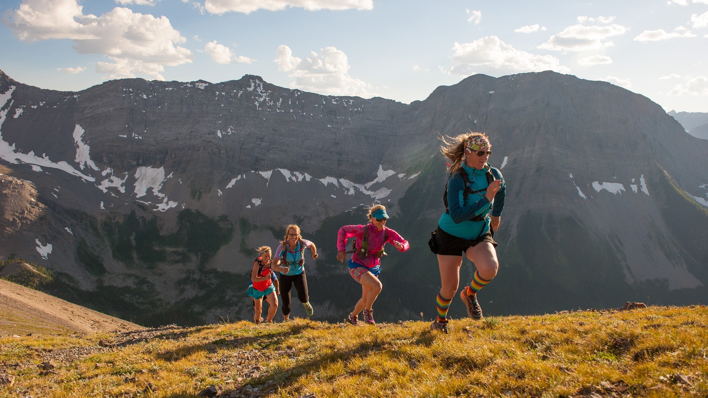 Trail runners on mountain summit