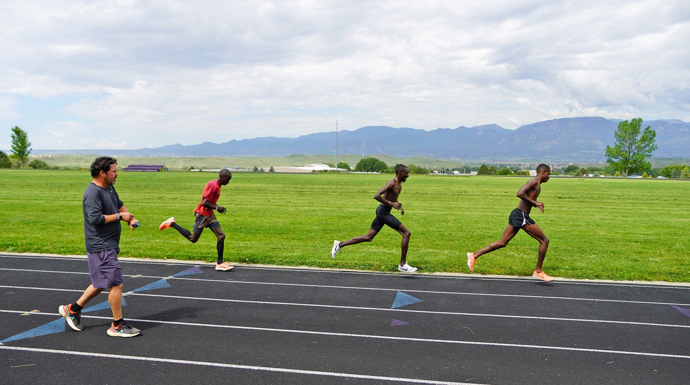 American Distance Project runners doing speed session with coach Scott Simmons
