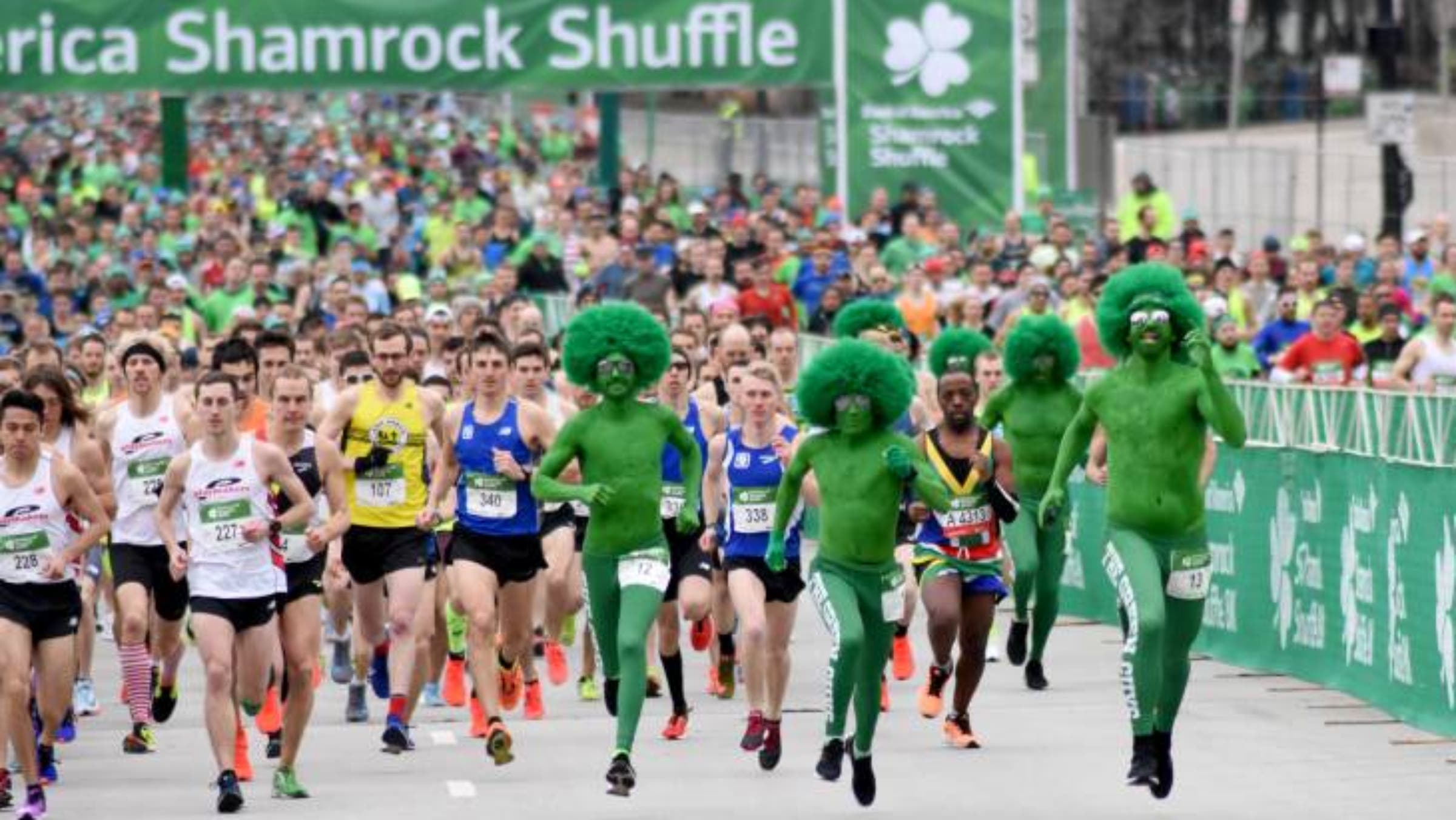 Runner race from the starting line in the 2019 Bank of America Shamrock Shuffle