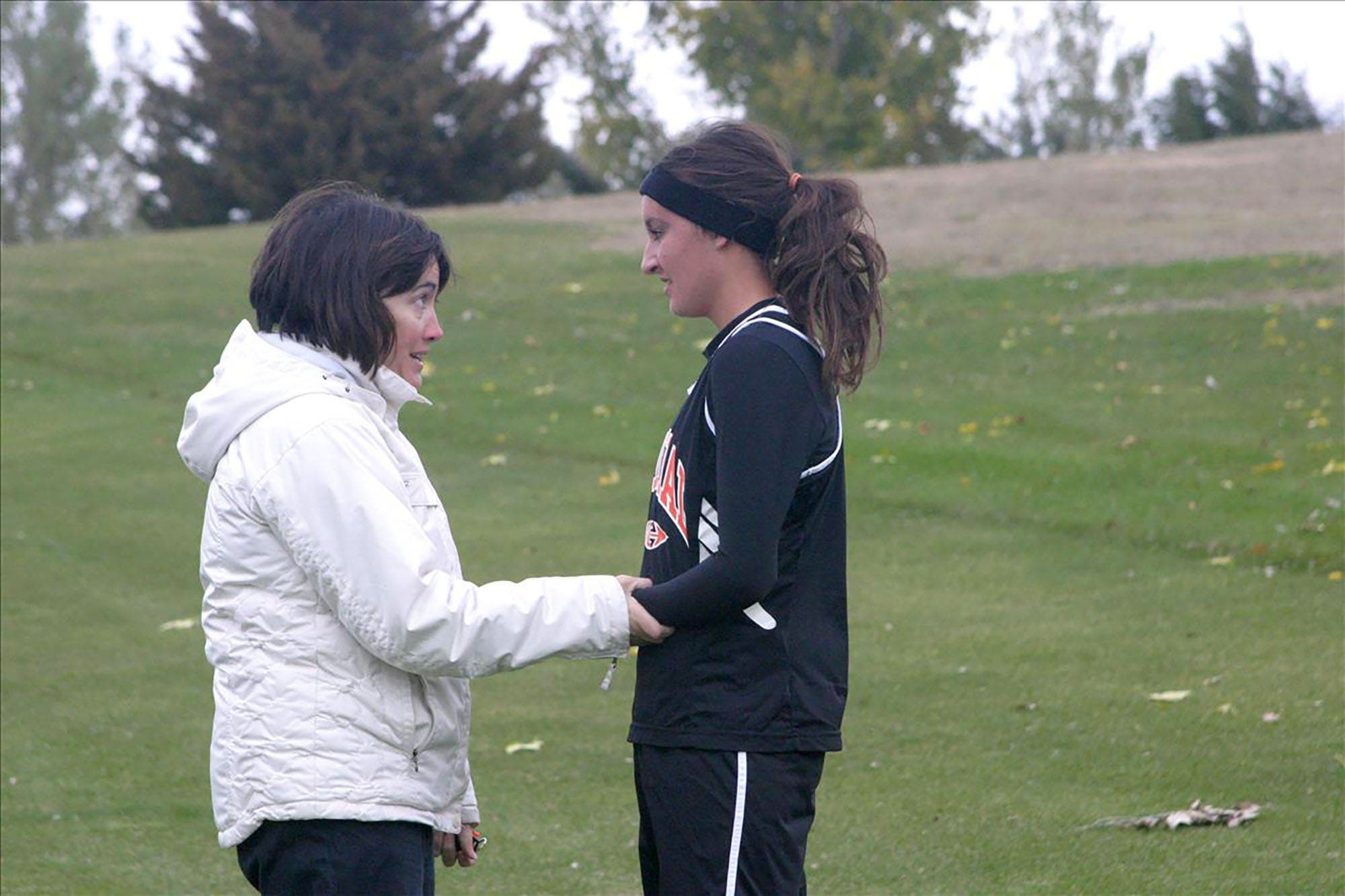 older woman and her daughter post race