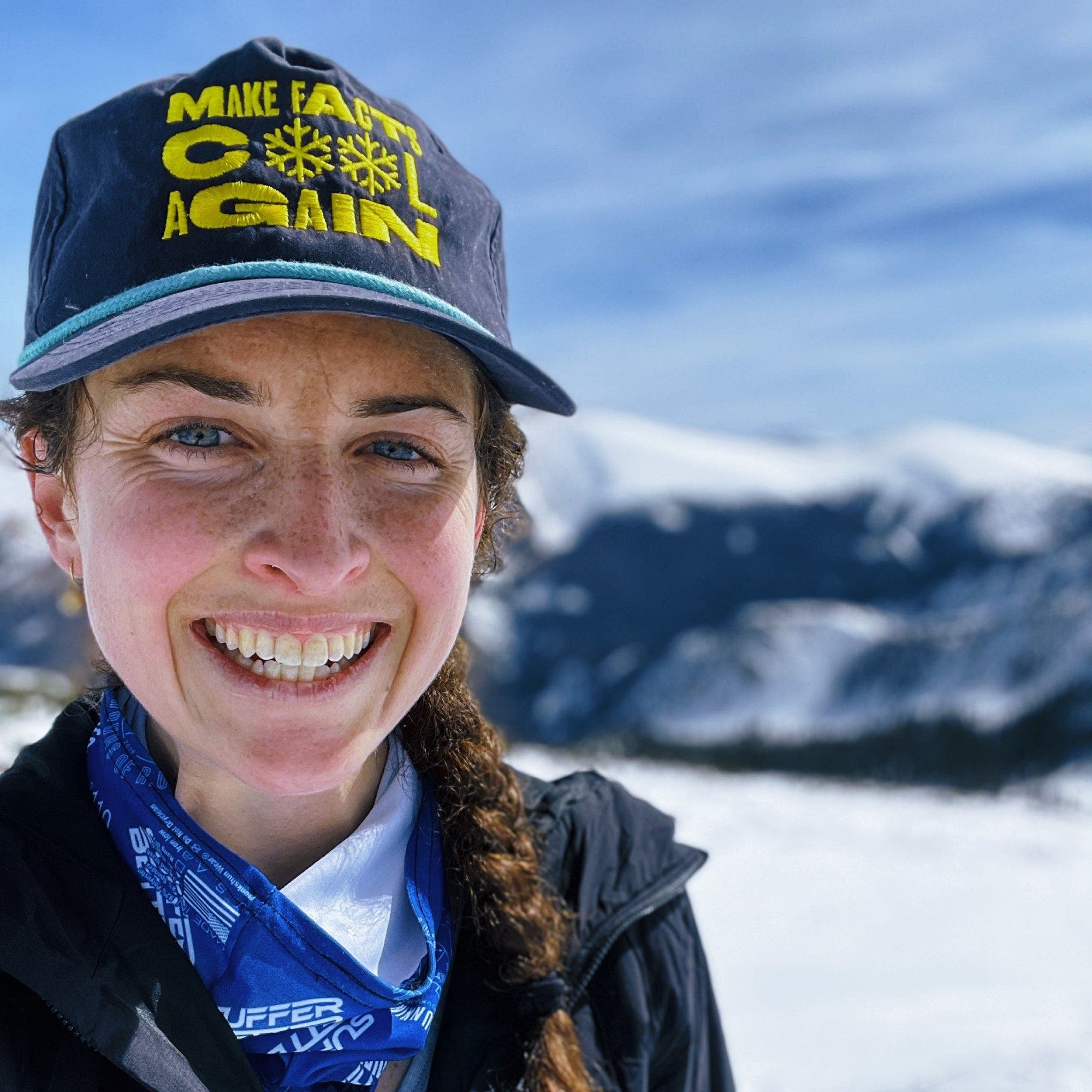 Close-up shot of woman outside in snow-covered mountains
