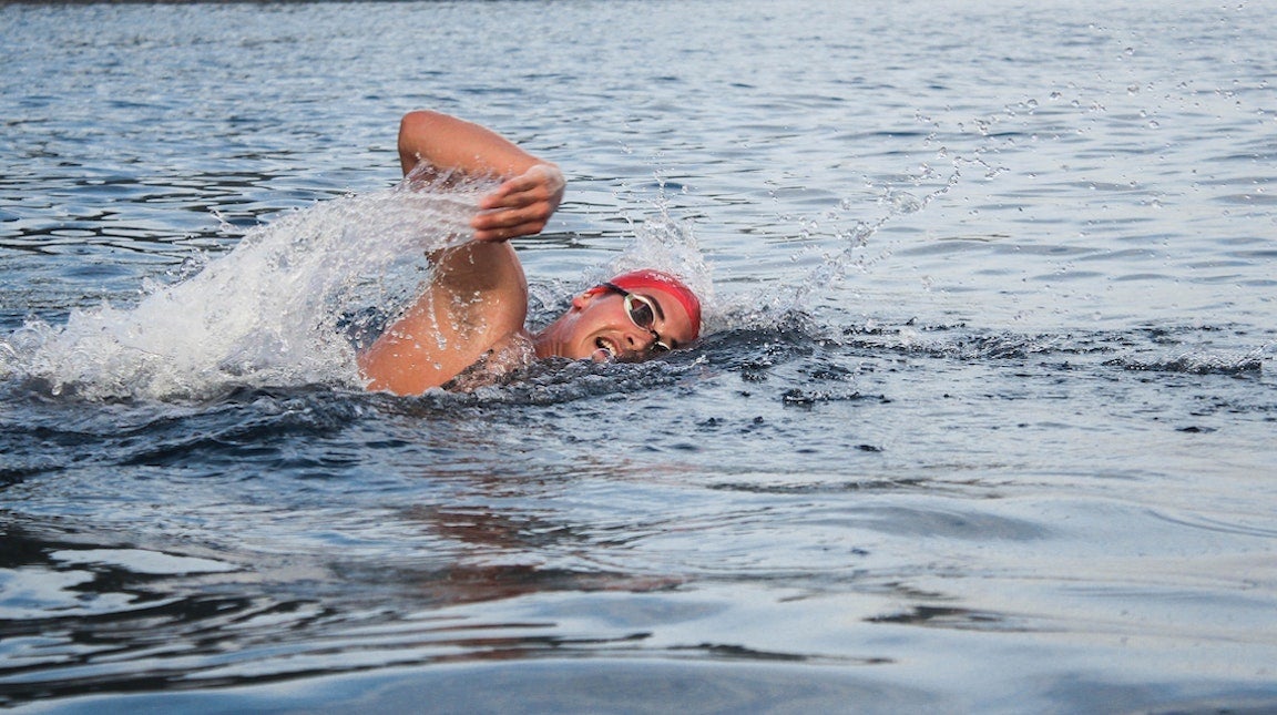 Woman swimming outside.