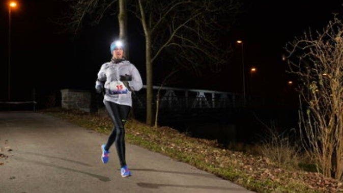 Astrid Leutert running in Swiss winter dark
