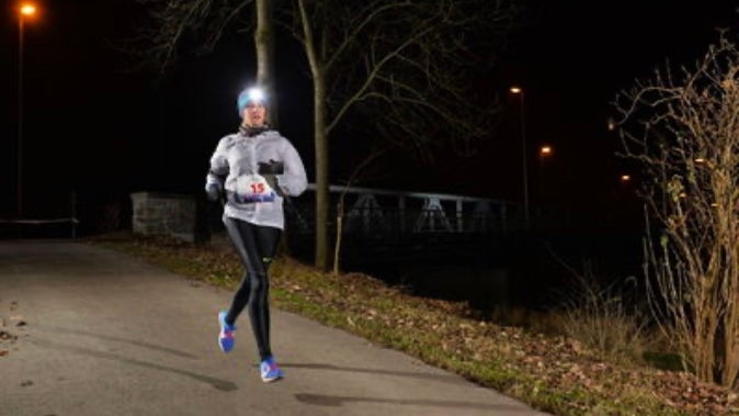Astrid Leutert running in Swiss winter dark 