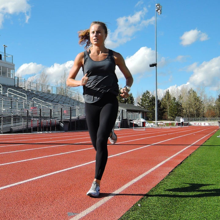 woman running intervals on track