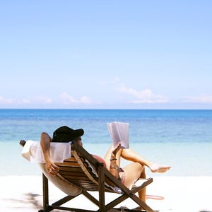 Woman reading on the beach.
