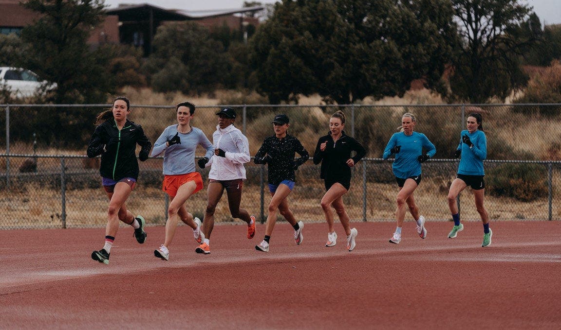 The Bowerman Track Club women doing a workout on the track.