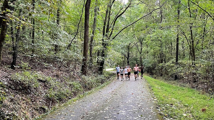 The University School of Nashville cross country team jogging down between uphill repeats in the Sisyphus Session.