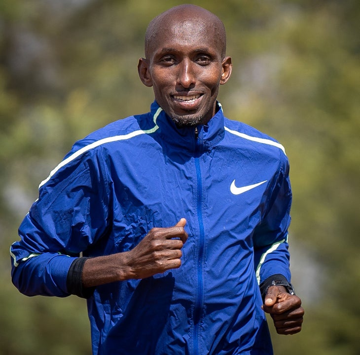 Abdi Abdirahman running and smiling