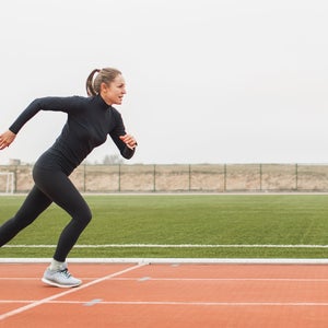 woman starting next interval on track