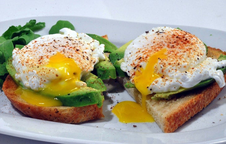 Eggs on avocado toast.