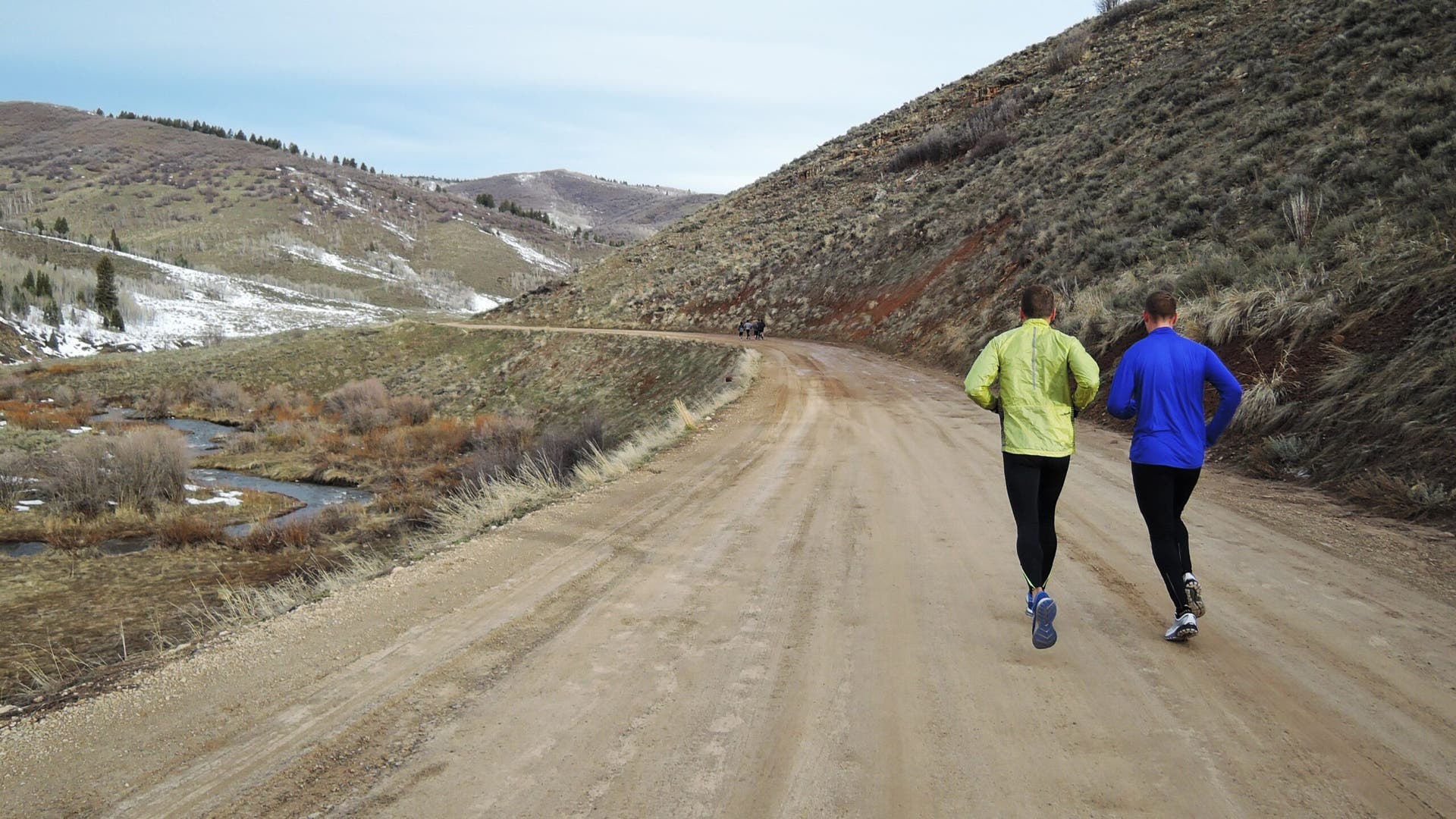 running on dirt road in mountains winter