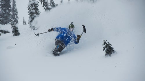 A sit-skier carves a line