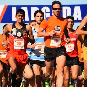 Runners racing in a road race in the summer.