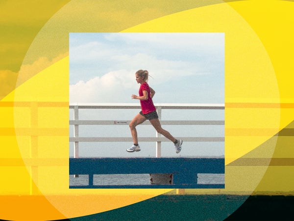 a women with a red shirt is running