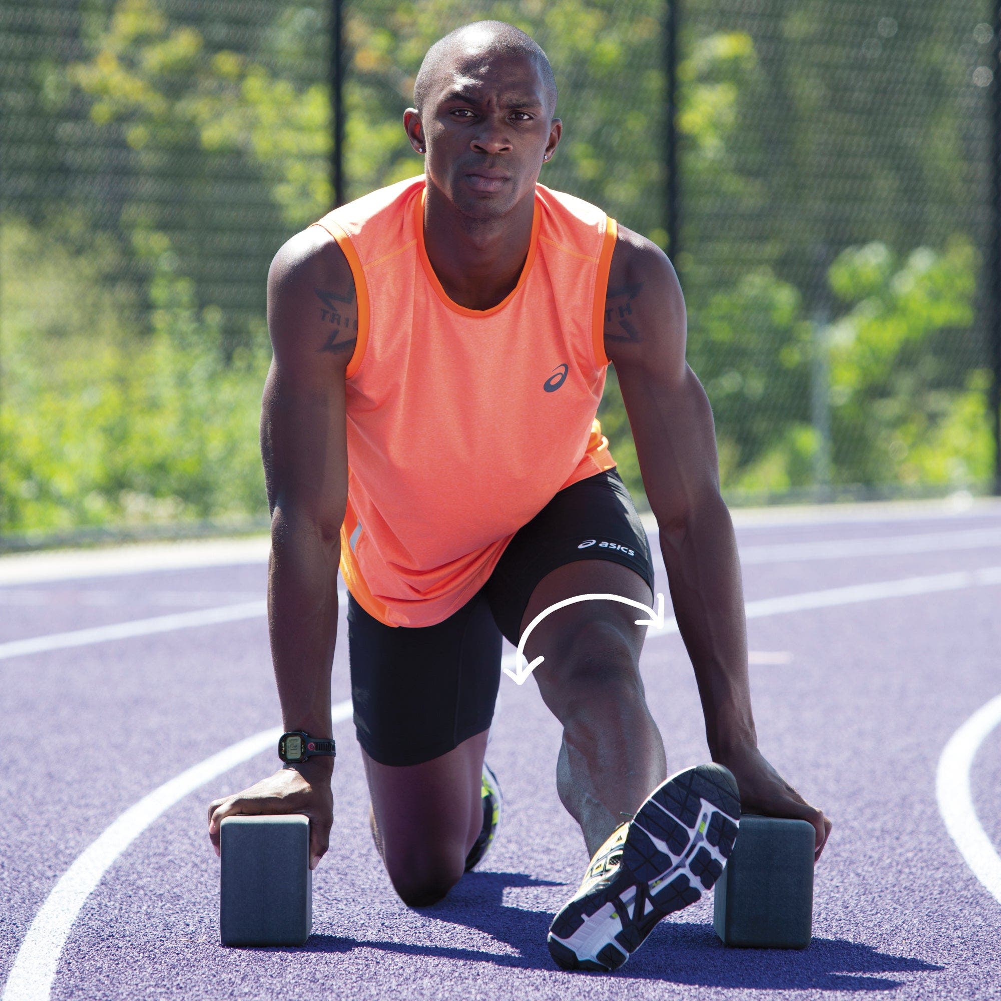 Man in half split facing camera supported by blocks