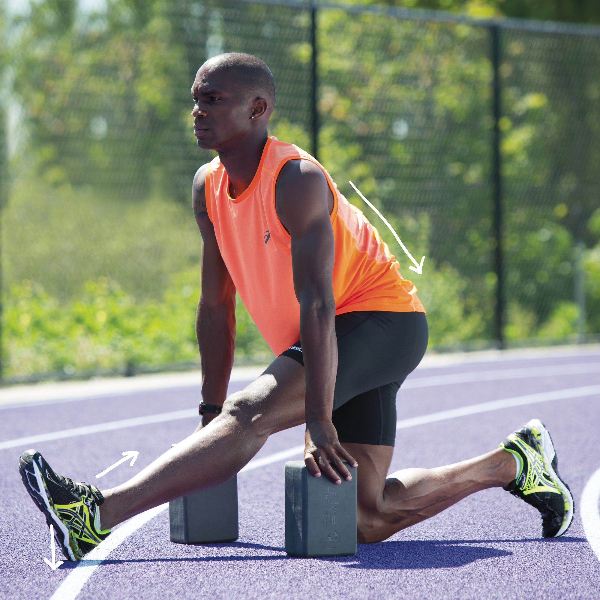 Man in half split using yoga blocks for support
