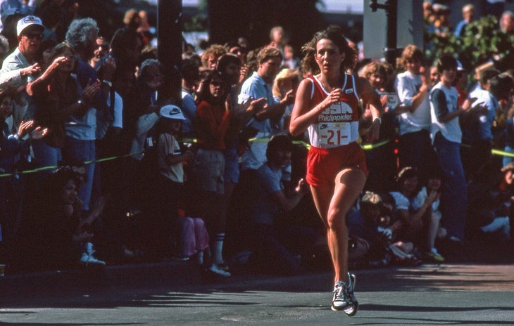 Old photo of runner in red at a road race in the '80s.