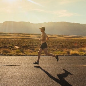 Man running in desert heat.