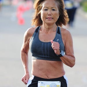 Woman running a road race