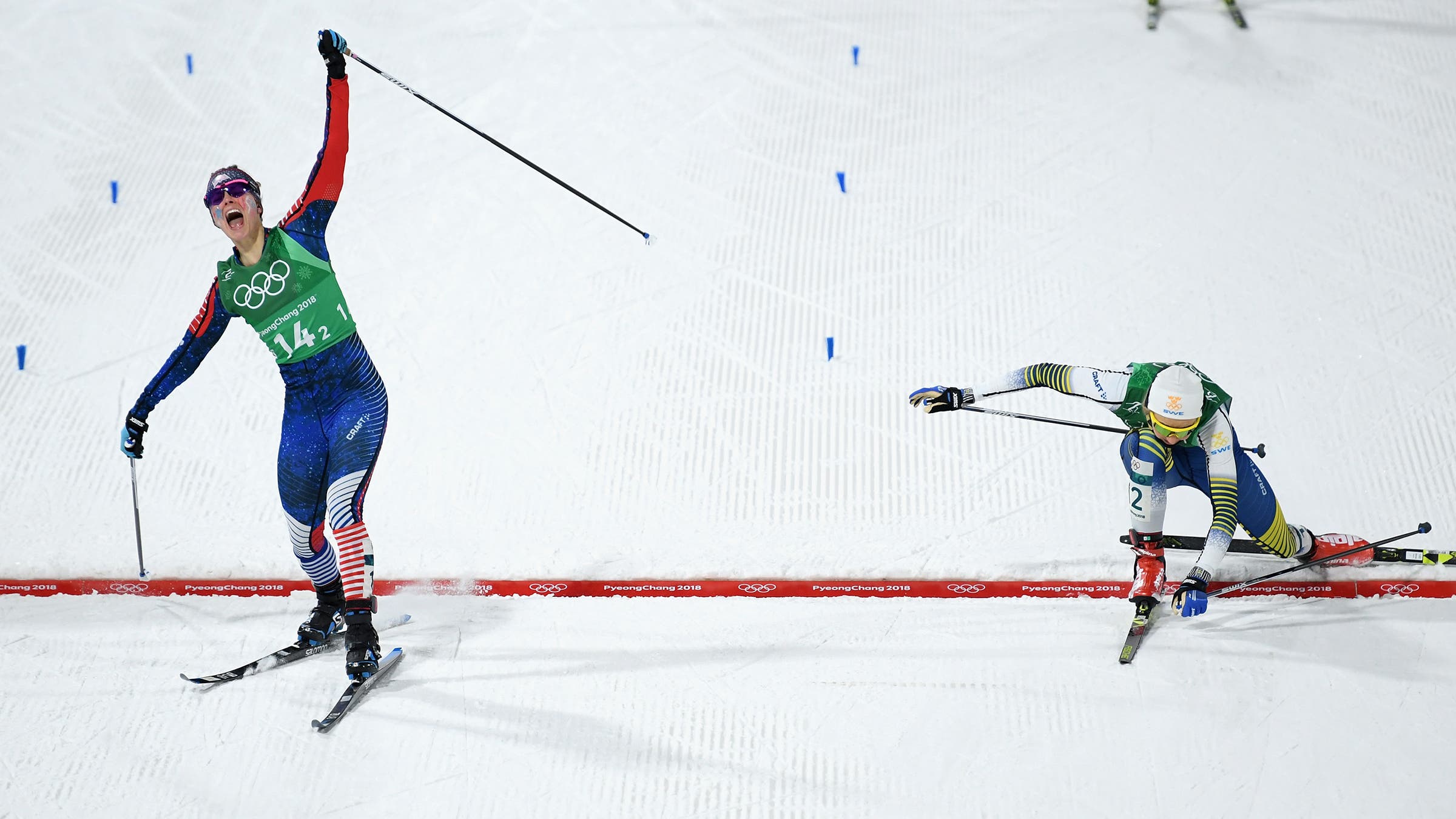 Diggins nips Sweden’s Stina Nilsson at the finish line in 2018 to win the United States its first-ever Olympic gold in nordic skiing.