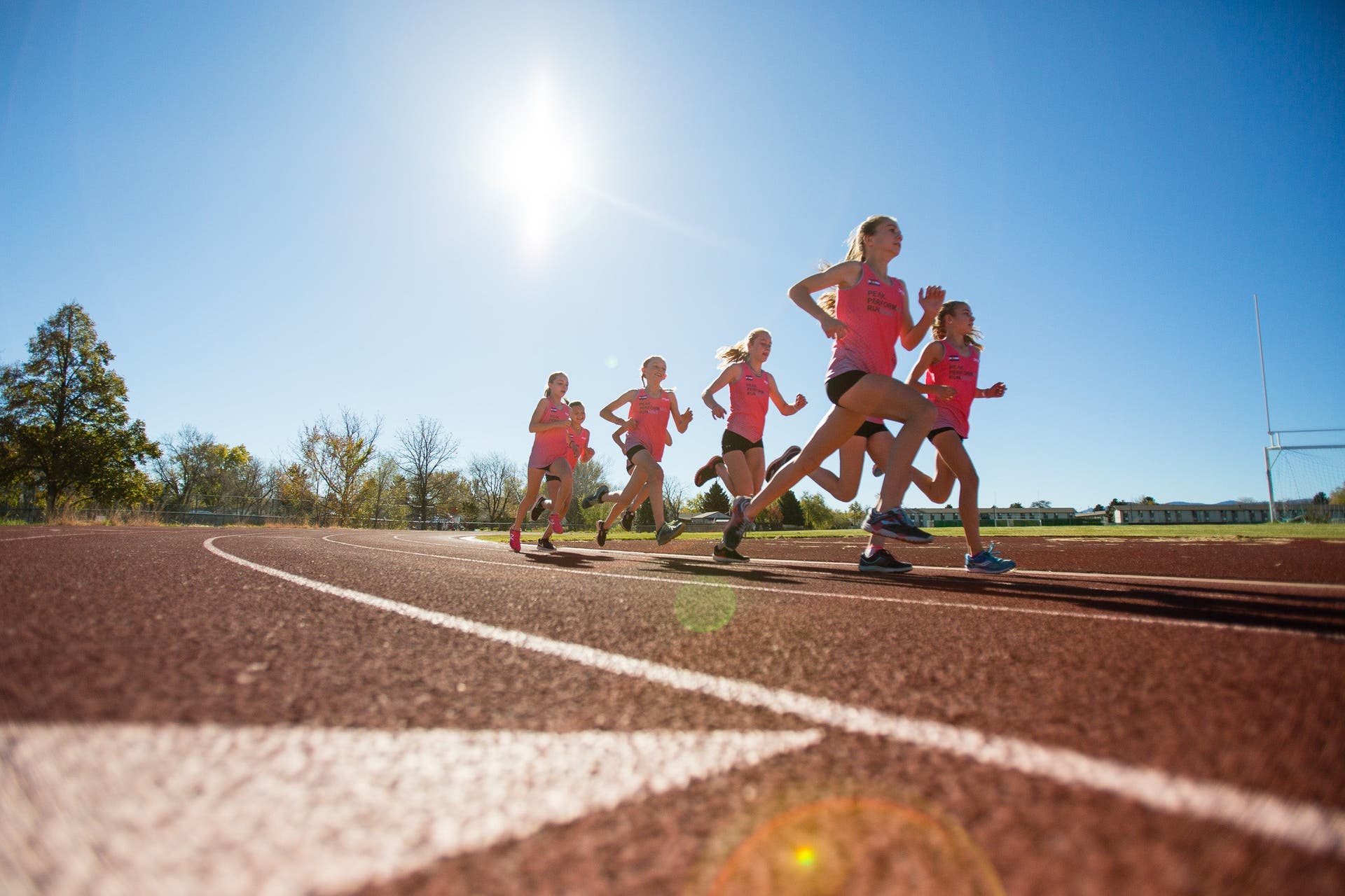 high school girls training on track