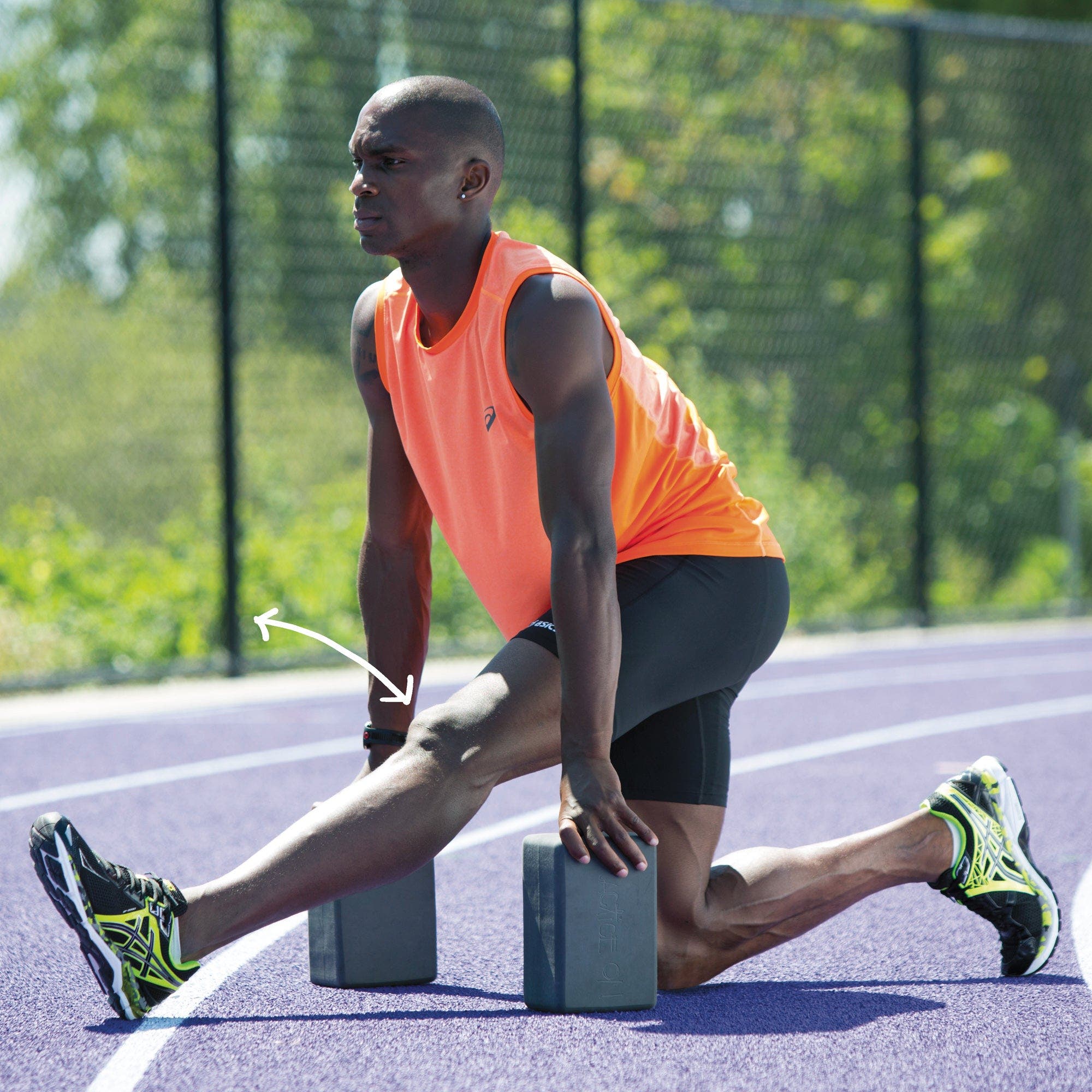 Man in half split supported by yoga blocks