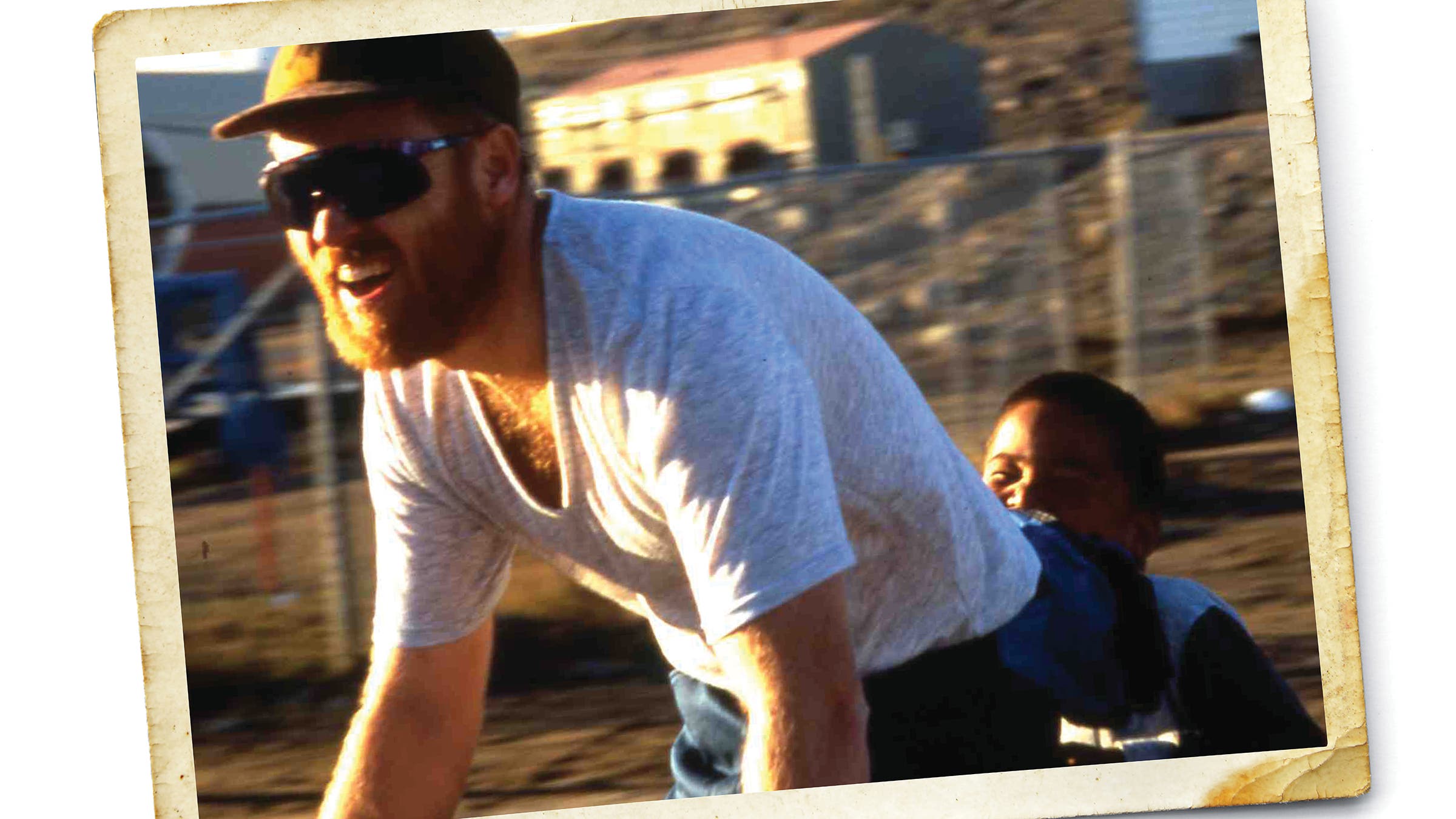 Mike giving a local kid a ride before the start of the expedition to Baffin Island