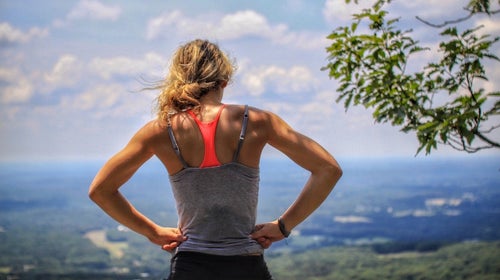 Tired athlete looking out over a hill.