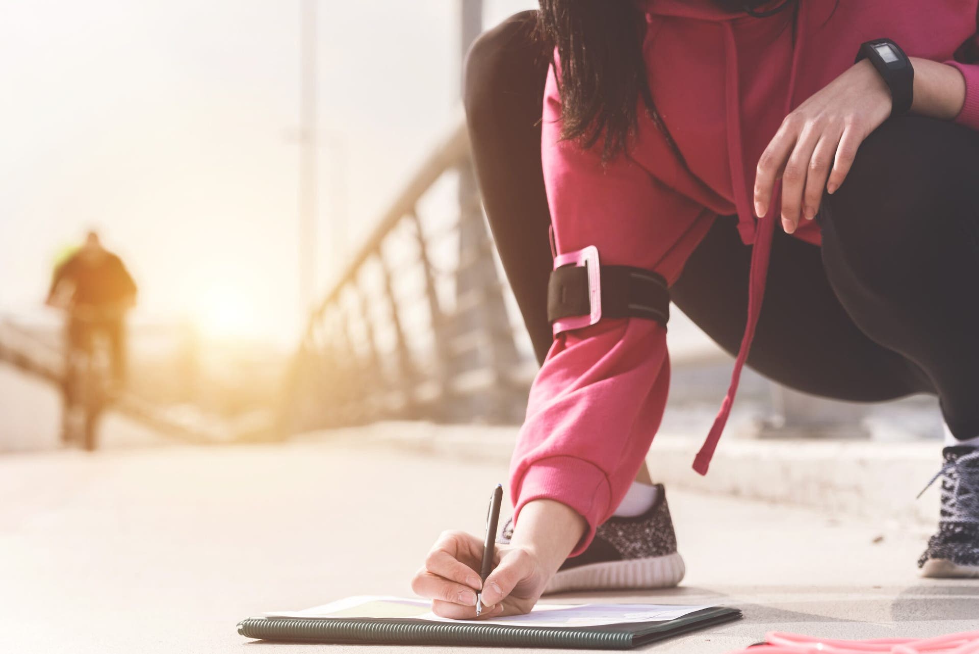 runner checking training schedule