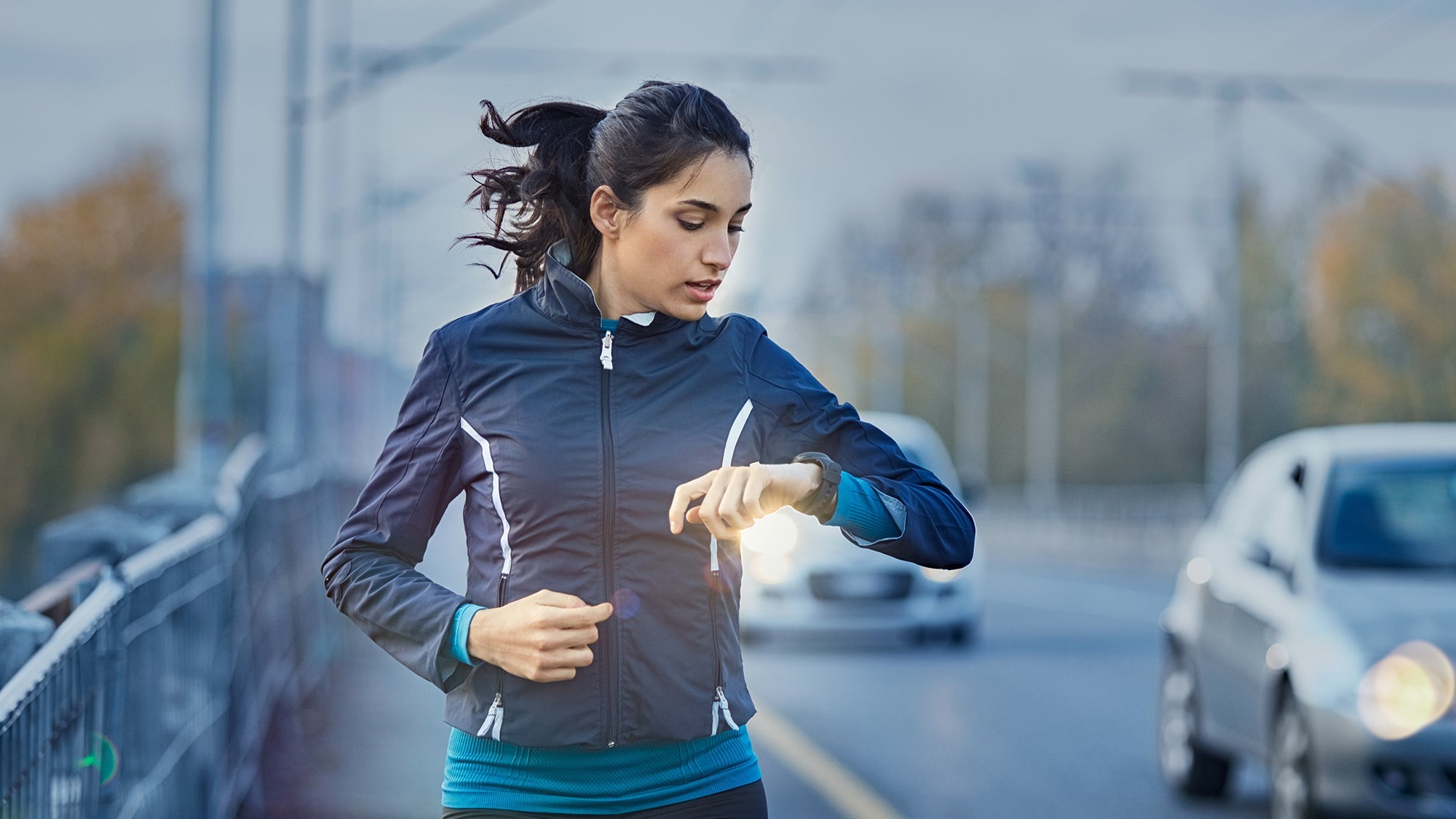 runner checking watch data on the run