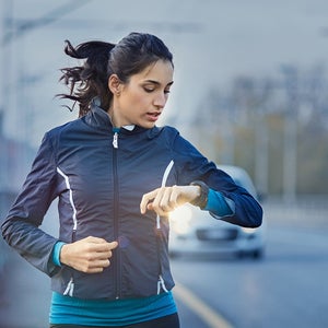 runner checking watch data on the run