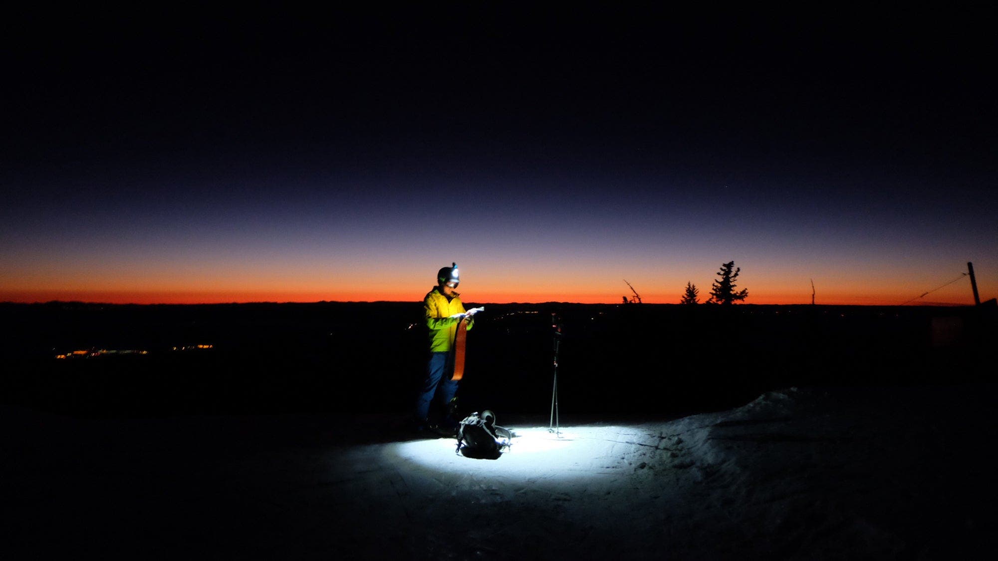 Checking ski routes pre-dawn