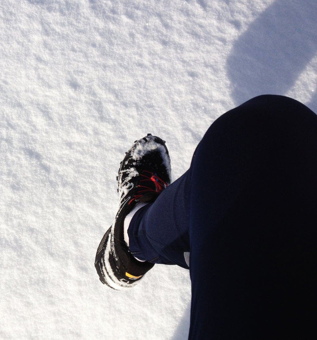 snow covered running shoe
