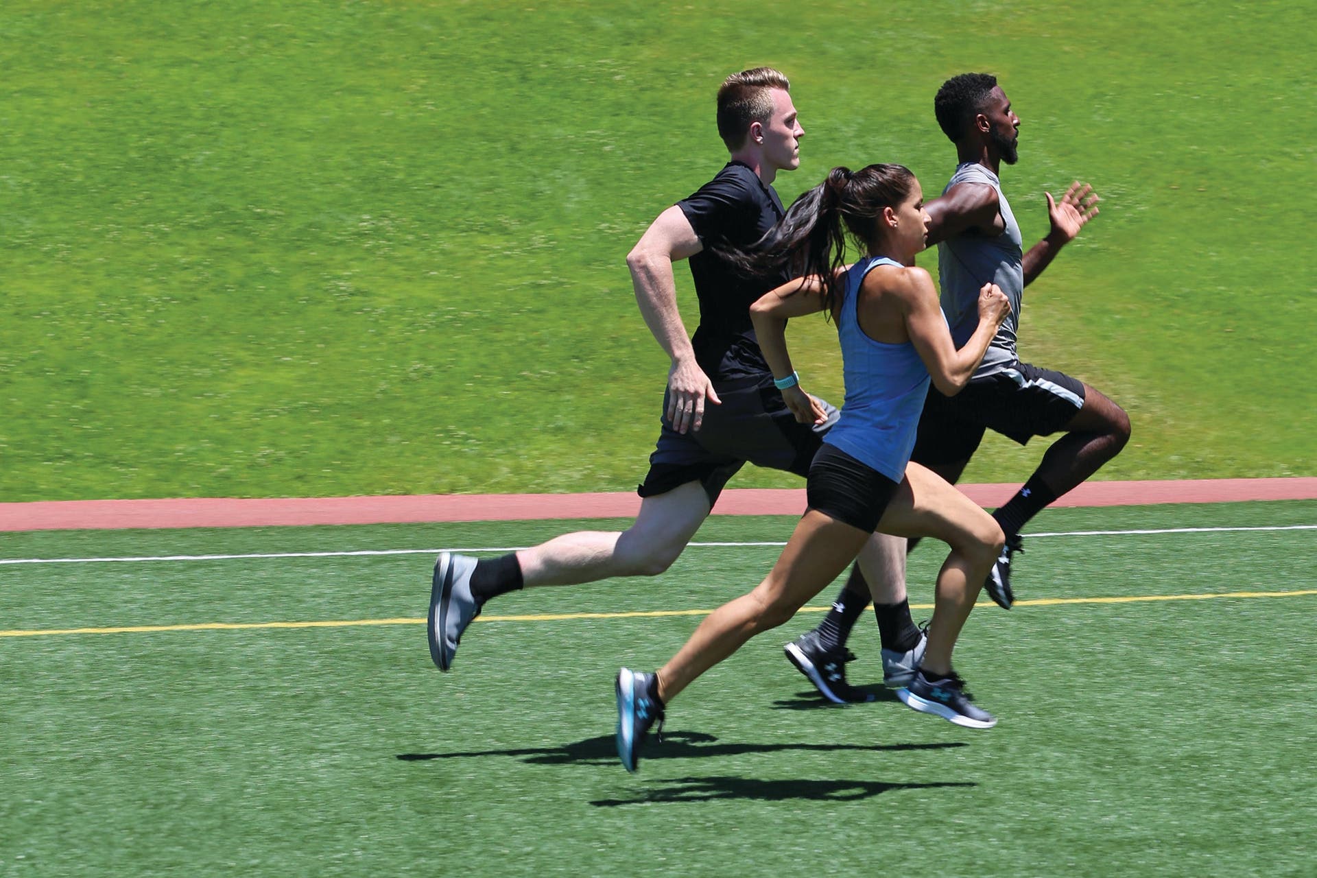 group sprinting on field