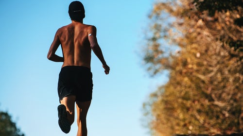 Runner with CGM sensor