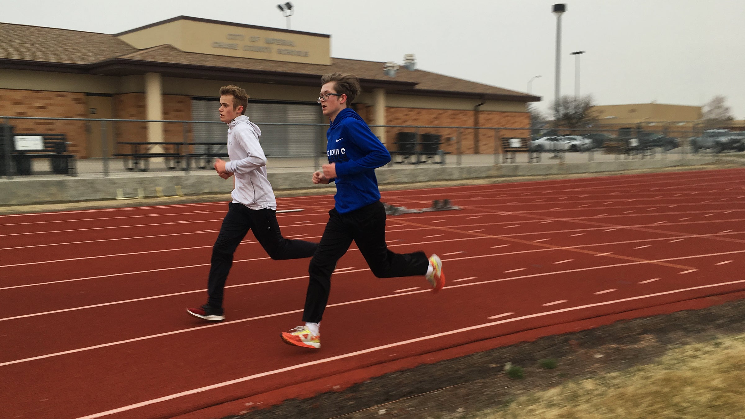 young men training on a track