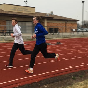 young men training on a track